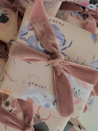 Sister Paper Co zodiac star sign wrapping paper gift wrapped box with pink velvet bow