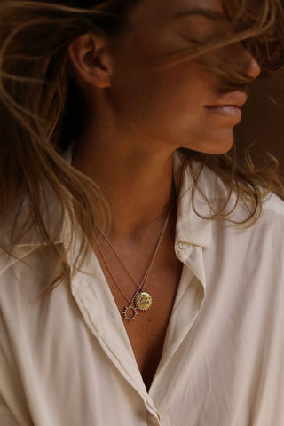 Audrey leighton wearing gold lunar jewellery