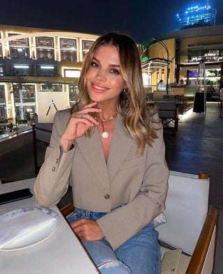 Chloe Lewis wearing gold lunar jewellery