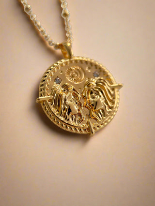 18k gold plated brass Gemini star sign Zodiac Necklace with cubic zirconia stones and intricate detailing on a coin disc pendant and on fine ball chain.