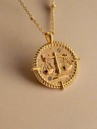 18k gold plated brass Libra star sign Zodiac Necklace with cubic zirconia stones and intricate detailing on a coin disc pendant and on fine ball chain - Gold Lunar