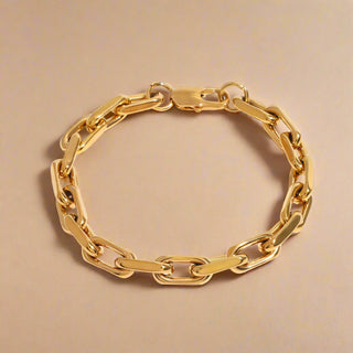 Gold chain bracelet on a white background
