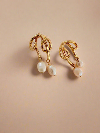 Pretty Bow earring with two freshwater pearl drops on each earring in 18k gold plating display on a white jewellery dish.