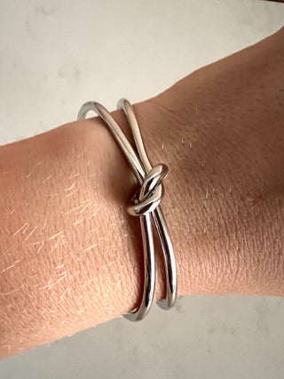 Silver Plated Knot Cuff Bracelet - Gold Lunar worn on model showing the detail on the knot design.