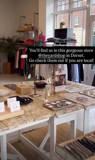 Store interior with tables and products, promotional text overlay.