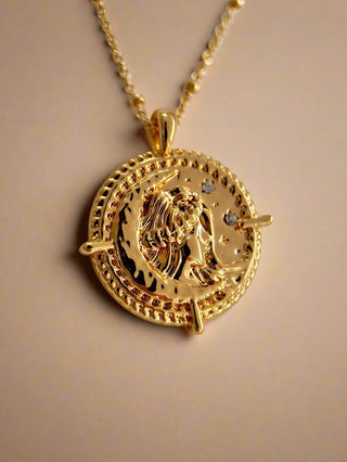 18k gold plated brass Virgo star sign Zodiac Necklace with cubic zirconia stones and intricate detailing on a coin disc pendant and on fine ball chain.