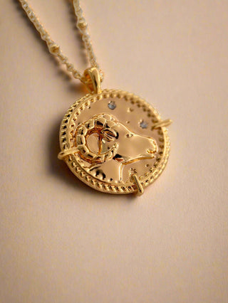 18k gold plated brass Aries star sign  Zodiac Necklace with cubic zirconia stones and intricate detailing on a coin disc pendant and on fine ball chain