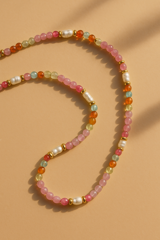 Beaded necklace with multicolored beads on a beige background