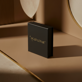 Black box with 'GOLD LUNAR' branding on a beige surface