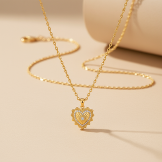 Gold necklace with a heart-shaped pendant on a beige background