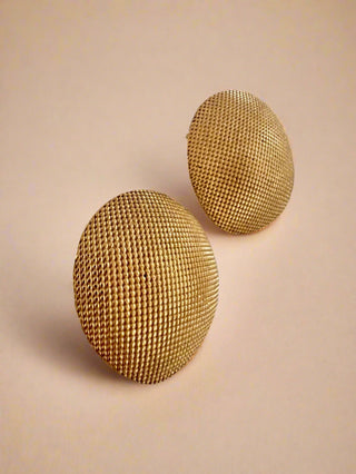 18k gold plated Large round textured studs earrings displayed on white jewellery dish