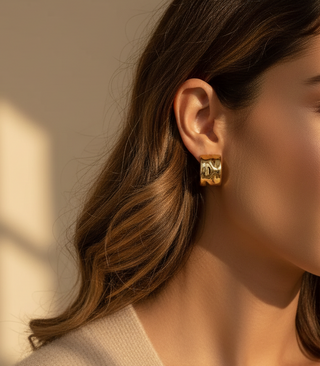 Molten gold hoops on model