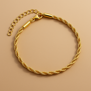 Gold chain bracelet on a beige background